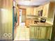 Bright kitchen with wood cabinets, stainless steel appliances, and granite countertops at 4419 Liberty Loop Rd, Martinsville, IN 46151