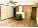 Living room featuring hardwood floors, wood paneling, and a fireplace at 4419 Liberty Loop Rd, Martinsville, IN 46151
