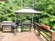 Outdoor deck with multiple grilling stations, perfect for entertaining at 4419 Liberty Loop Rd, Martinsville, IN 46151