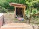 View of the shed on the deck featuring stairs and an American flag on the ground at 4419 Liberty Loop Rd, Martinsville, IN 46151