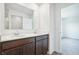 Bathroom with double sinks and dark wood cabinets at 4785 E Shadowbrook Dr, Camby, IN 46113