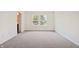Bedroom with neutral carpet and a large window at 4785 E Shadowbrook Dr, Camby, IN 46113