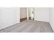 Cozy bedroom featuring neutral carpet, white walls, and an open doorway at 4785 E Shadowbrook Dr, Camby, IN 46113