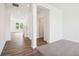 Bright entryway with hardwood floors, white walls, and view to the living area at 4785 E Shadowbrook Dr, Camby, IN 46113
