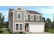 Charming two-story home with neutral siding, white trim, and an attached two-car garage at 4785 E Shadowbrook Dr, Camby, IN 46113