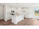 Modern kitchen with white cabinets, marble countertops, and stainless steel appliances at 4785 E Shadowbrook Dr, Camby, IN 46113