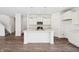 Stylish kitchen with white cabinets, an island, and stainless steel appliances at 4785 E Shadowbrook Dr, Camby, IN 46113