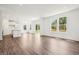 Spacious living room with hardwood floors, natural light, and a sliding glass door at 4785 E Shadowbrook Dr, Camby, IN 46113