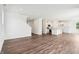 Open concept living room with hardwood floors and view to the kitchen at 4785 E Shadowbrook Dr, Camby, IN 46113