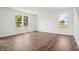 Bright living room with large windows and hardwood flooring at 4785 E Shadowbrook Dr, Camby, IN 46113