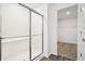 Bathroom with walk in shower and white tiling at 4785 E Shadowbrook Dr, Camby, IN 46113