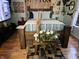 Cozy bedroom features rustic wooden furniture, a comfortable bed with striped bedding, and unique wall decor at 4962 Potomac Square Pl, Indianapolis, IN 46268