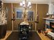 Cozy dining area featuring a unique table setting, decorative mirrors, and warm lighting at 4962 Potomac Square Pl, Indianapolis, IN 46268