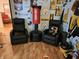 Cozy game room area featuring comfortable seating and a punching bag, decorated with Steelers motifs at 4962 Potomac Square Pl, Indianapolis, IN 46268
