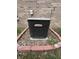 Exterior shot of the home's Lennox AC unit with brick edging and landscaped space at 5486 Lipizzan Ln, Plainfield, IN 46168