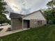 Back exterior of home showcasing brick facade and well-maintained lawn at 5486 Lipizzan Ln, Plainfield, IN 46168