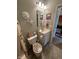 Bathroom featuring a shower/tub combo, a toilet, and a sink at 5486 Lipizzan Ln, Plainfield, IN 46168