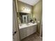 Bathroom with a large mirror and a marble countertop vanity area at 5486 Lipizzan Ln, Plainfield, IN 46168