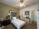 Bedroom with white bed, decor, and an open doorway at 5486 Lipizzan Ln, Plainfield, IN 46168