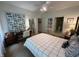 Comfortable bedroom featuring a double bed, ceiling fan, and natural light from the windows at 5486 Lipizzan Ln, Plainfield, IN 46168