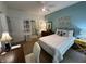 Comfortable bedroom featuring a double bed, light green walls, and a work desk near the window at 5486 Lipizzan Ln, Plainfield, IN 46168