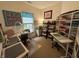 Well-organized craft room with sewing and cutting tables, ample storage shelves, and crafting supplies at 5486 Lipizzan Ln, Plainfield, IN 46168