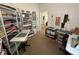 A brightly lit craft room featuring multiple work surfaces and storage units at 5486 Lipizzan Ln, Plainfield, IN 46168