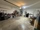View of the garage with overhead lighting and concrete floors at 5486 Lipizzan Ln, Plainfield, IN 46168