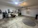 Open two car garage with overhead lighting and painted walls at 5486 Lipizzan Ln, Plainfield, IN 46168