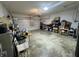 Spacious two car garage with overhead lighting and concrete floors at 5486 Lipizzan Ln, Plainfield, IN 46168