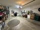 A shot of a two-car garage with a concrete floor, overhead lighting, and storage shelves at 5486 Lipizzan Ln, Plainfield, IN 46168