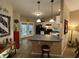 Charming kitchen with white cabinets, black appliances, and breakfast bar at 5486 Lipizzan Ln, Plainfield, IN 46168
