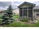 The exterior of the home features a screened porch with lush landscaping at 5486 Lipizzan Ln, Plainfield, IN 46168