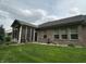 The exterior of the home features a screened porch with a door for easy access to the backyard at 5486 Lipizzan Ln, Plainfield, IN 46168