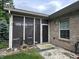 The exterior of the home features a screened porch with landscaping and a decorative fence at 5486 Lipizzan Ln, Plainfield, IN 46168