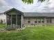 The exterior of the home features a screened porch surrounded by a well-manicured lawn at 5486 Lipizzan Ln, Plainfield, IN 46168