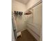Walk-in closet with hanging racks and shelving for organized storage at 5486 Lipizzan Ln, Plainfield, IN 46168