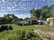Backyard featuring a detached garage and ample space for outdoor activities at 5601 Milhouse Rd, Indianapolis, IN 46221