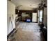 View of a kitchen with laminate flooring and ample natural light at 5601 Milhouse Rd, Indianapolis, IN 46221