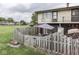 Fenced backyard with patio, umbrella and second story decks provides a relaxing outdoor space at 57 Trails End St, Greenwood, IN 46142