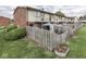 A backyard with well-maintained landscaping provides a peaceful view of the back of the building at 57 Trails End St, Greenwood, IN 46142
