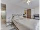 Relaxing bedroom featuring neutral tones, soft lighting, and a cozy spot for reading or TV watching at 57 Trails End St, Greenwood, IN 46142