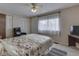 Comfortable bedroom with ample natural light, ceiling fan, and closet space for storage needs at 57 Trails End St, Greenwood, IN 46142