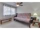 A futon in a room with a bench, a ceiling fan, and a window at 57 Trails End St, Greenwood, IN 46142