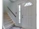 Bright entryway with staircase and stylish front door at 57 Trails End St, Greenwood, IN 46142