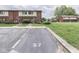 Well-maintained exterior with parking space #57 and green spaces create curb appeal at 57 Trails End St, Greenwood, IN 46142