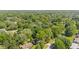 An aerial view showcases a neighborhood with mature trees and well-maintained homes at 5843 N Oakland Ave, Indianapolis, IN 46220