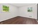 Bright bedroom with hardwood floors, and large windows that let in plenty of natural light at 5843 N Oakland Ave, Indianapolis, IN 46220