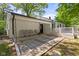 Covered patio with stone pavers and comfortable seating, perfect for relaxing and entertaining outdoors at 5843 N Oakland Ave, Indianapolis, IN 46220