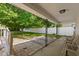 Covered patio with stone pavers and comfortable seating, perfect for enjoying the outdoors at 5843 N Oakland Ave, Indianapolis, IN 46220